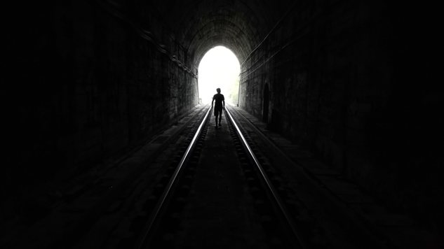 A person walking in a dark tunnel. Picture: Unsplash.